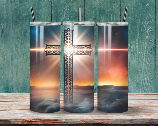 Sunset Serenity: Scrolled Cross Tumbler featuring an intricate cross design with radiant sunset hues, ideal for faith-inspired drinkware.